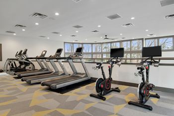 The arbors at breckinridge apartment homes gym with exercise machines